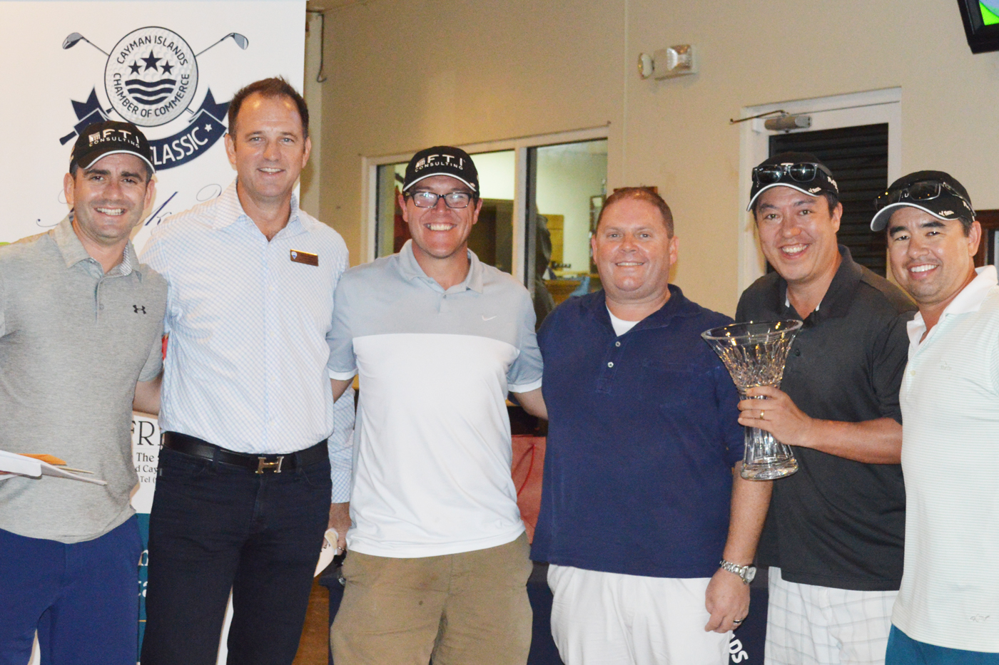 Chamber of Commerce President Paul Pearson, third from right, and James Bovell of platinum sponsor RE/MAX with the golfers in the winning team, from left, Andrew Morrison, David Griffin, Barnaby Gowrie and Matthew Goucke.