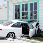 Teenager arrested after driving car into house