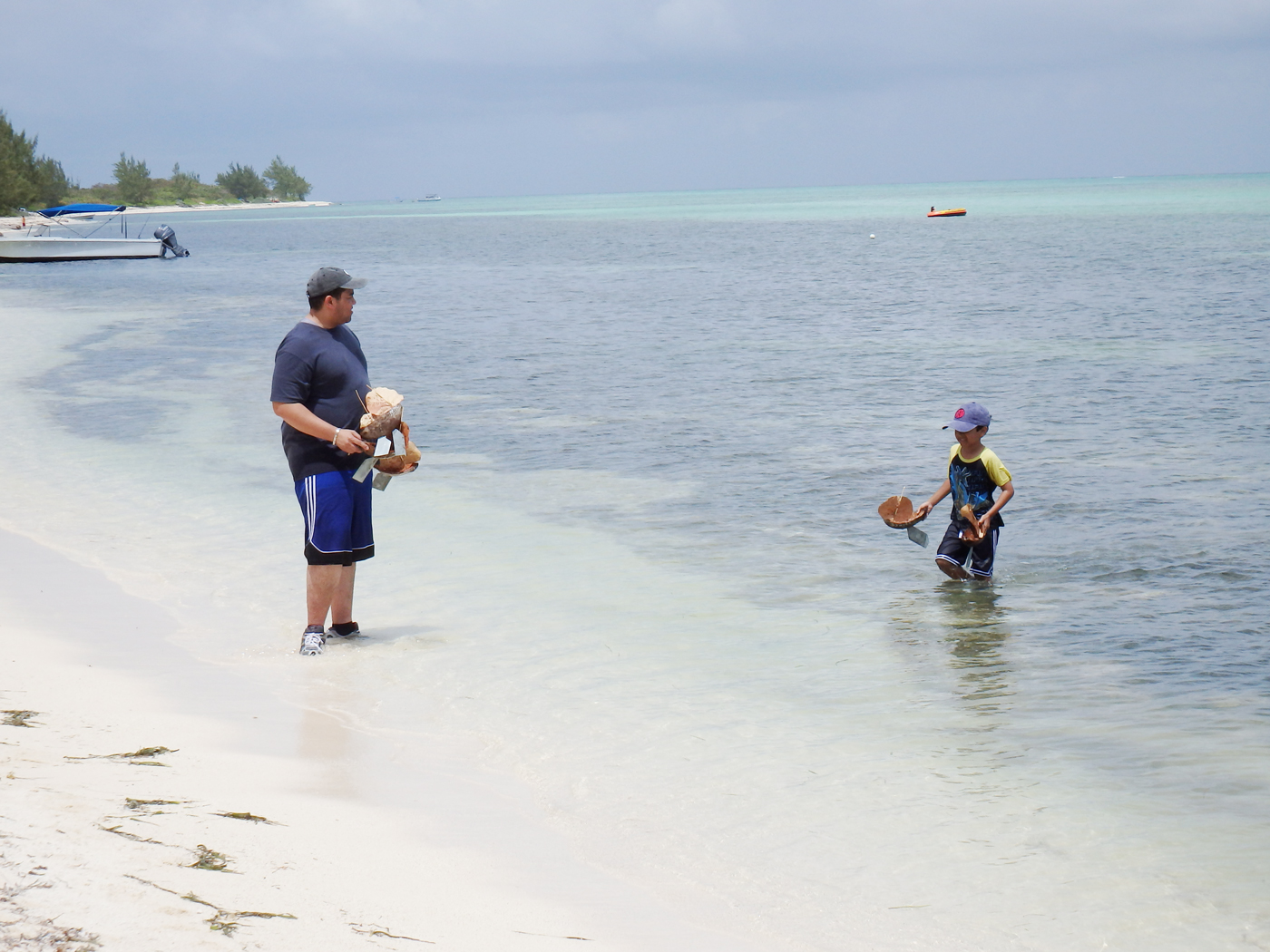 Newton Powery and his son Nathan had fun sailing coconut and grape leaf boats.