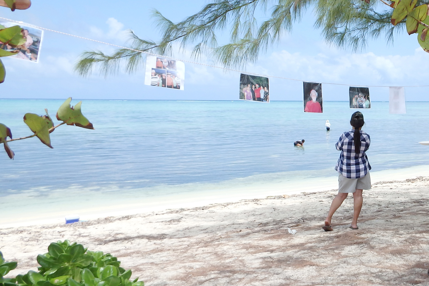 Clotheslines made for a perfect outdoor gallery for photos remembering Gressmon Ebanks.