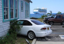 Two passengers hurt when car smashes into house