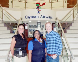 Cayman Airways and Digicel have joined forces to offer a rewards program. From left, Cayman Airways marketing and public relations manager Olivia Scott Ramirez, Cayman Airways customer service agent Sonia Robinson and Digicel’s brand and communications manager Guy Thornton.