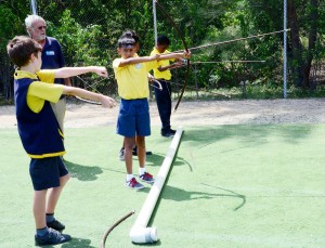Students take archery instruction from Phil Sciamonte.