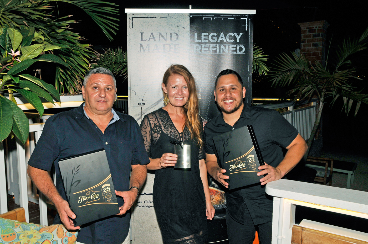 From left, Tortuga Fine Wine & Spirits’ Massimo Consolini and Nancy Harrison, along with Flor de Caña Brand Ambassador John Guilarte. – Photos: Alan Markoff