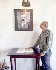Stacy Eden-Hurlston with the photo of his grandfather, William Eden III.
