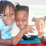 Families snuggle up and read at Cayman Academy