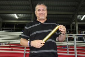 Deputy Governor Franz Manderson caught a signed gold relay baton that Bolt launched into the main grandstand.