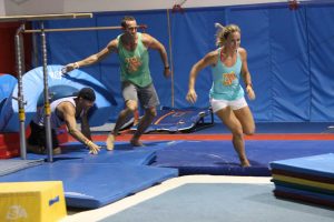 Chris Spigner, Grant Collier and Jen Floyd of team 7 Milers compete in an obstacle course. The team, which also included Sherwin Bouville, won last year’s Discovery Day Adventure Challenge.