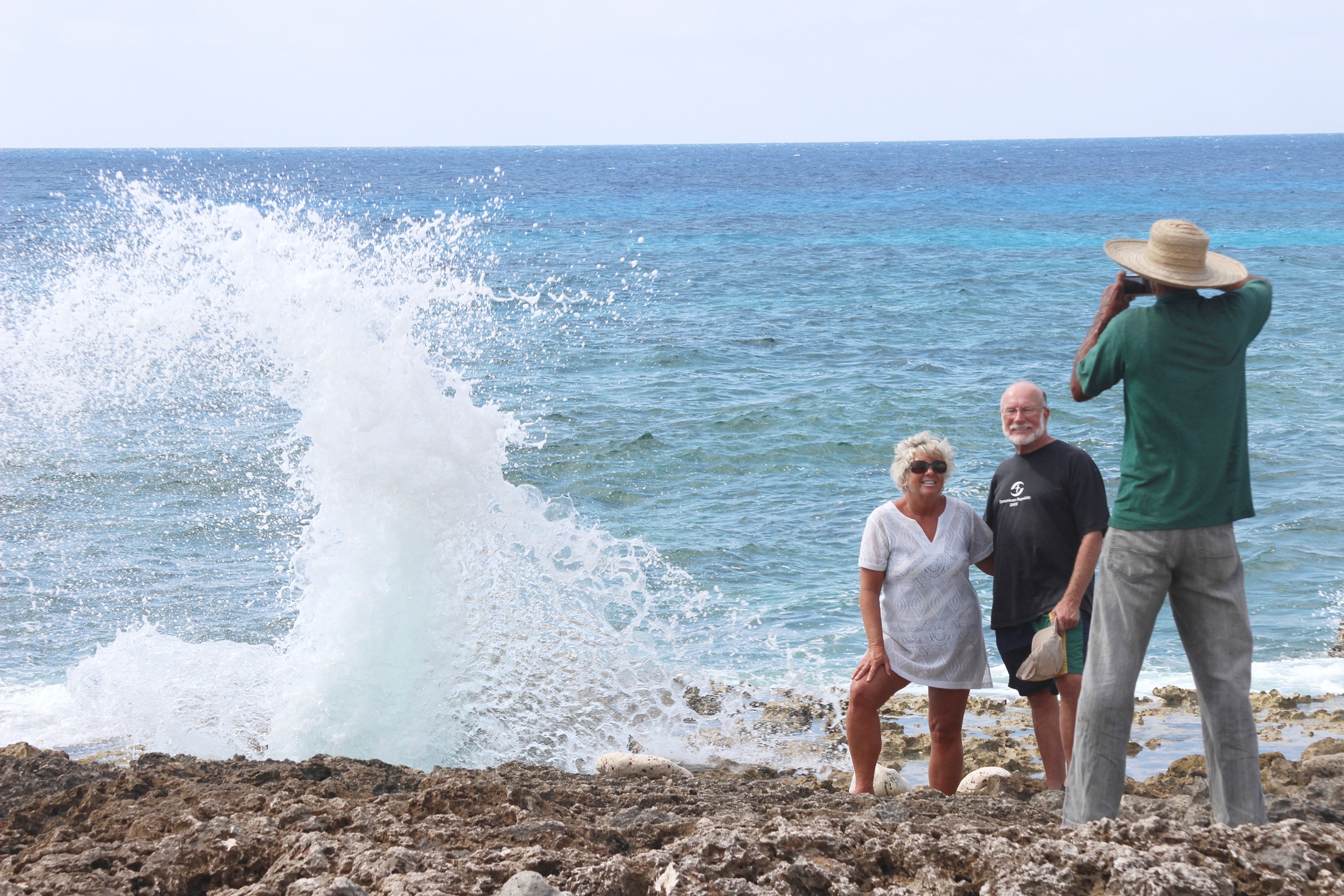 Alan Ebanks takes a picture for tourists visiting the blow holes.