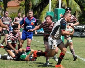 Edward Westin gets the ball to Joseph Westin who scores a try for Cayman Club Select.
