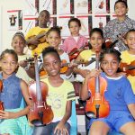 Students receive donated violins