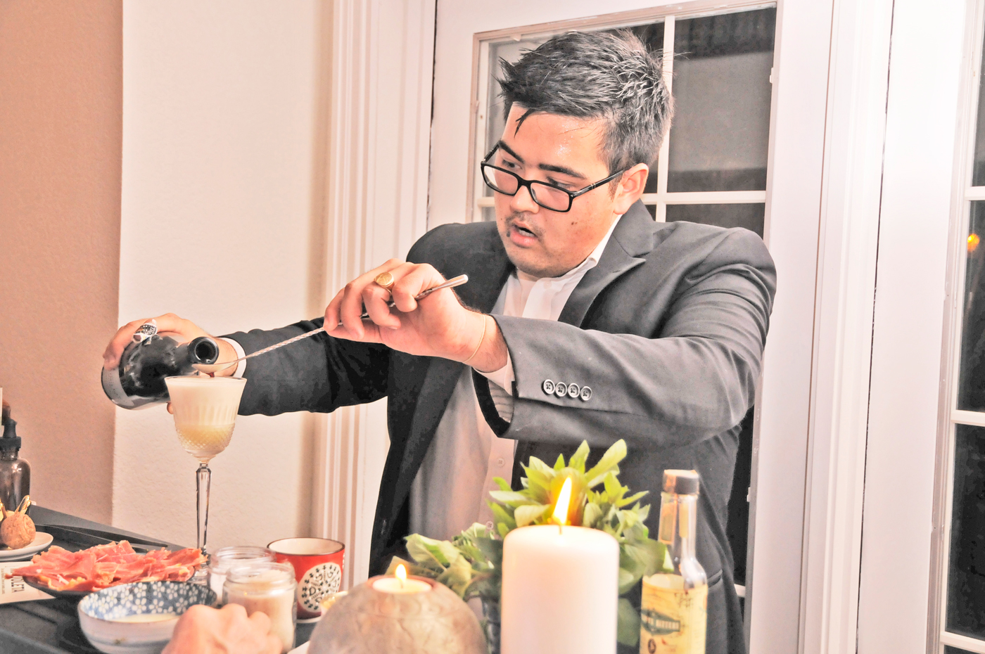 Josh Wludyka preparing 'The Grape & The Grain' cocktail.