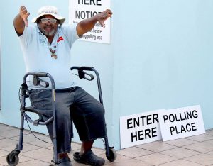 Bermudian voter Raynol Todd holding two thumbs down, indicating he voted no for the Same Sex Referendum which asked voters whether they supported gay marriage or civil unions for homosexual couples. - PHOTO: SIDEYA DIL, The ROYAL GAZETTE