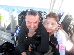 John Kennedy prepares to dive with wife and adaptive dive buddy Brigette.