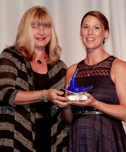 Jennifer Dodd, a head chef at The Ritz-Carlton’s Seven restaurant, accepts the restaurant manager of the year award from CITA board member Julie Hutton.