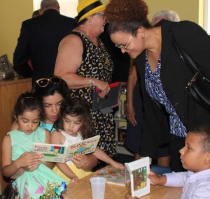 Minister Rivers with young readers at the library. – Photos: Jewel Levy