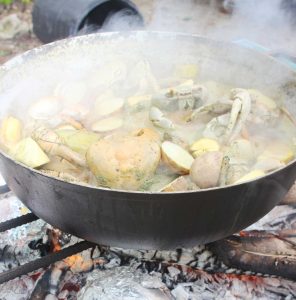 The crabs simmering over the coals.