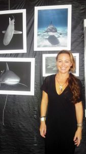 Photographer Ellen Cuylaerts with some of her photos of sharks, many taken up close and personal. - PHOTOS: NORMA CONNOLLY
