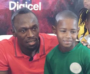 Shakur Connor got to meet and get his picture taken with Usain Bolt in Kingston.