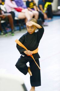 Eli O'Sullivan, 5, competing in forms.