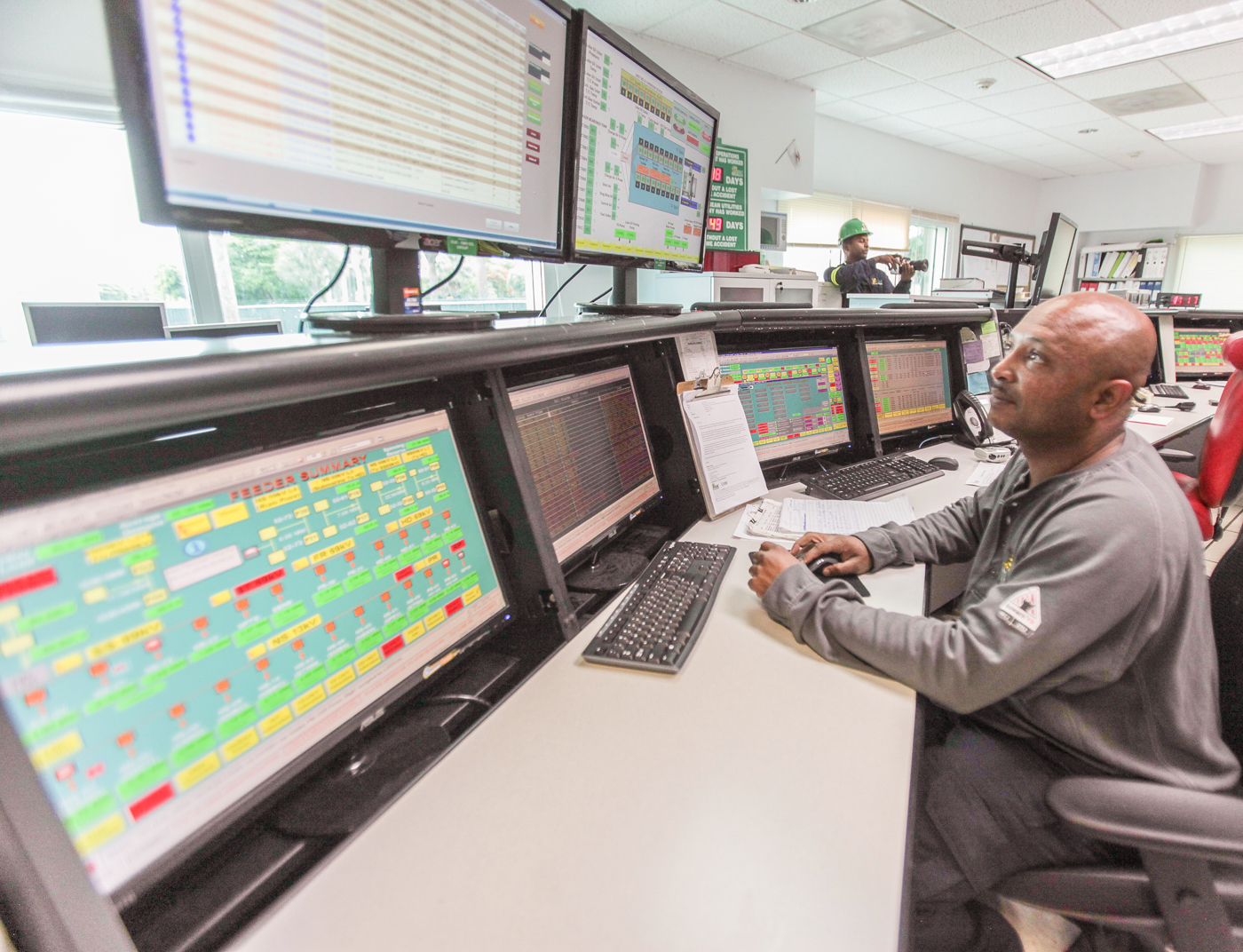 Lindon Dixon, control operator, monitors the Feeder Indicator, which detects power outages.