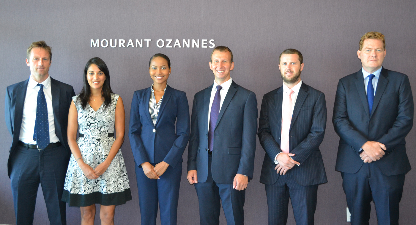 From left, Mourant Ozannes Counsel Mark Griffiths with Suk Kaur, Nicosia Lawson, Rupert Hamilton, Zach Hoskins and Partner Simon Dickson
