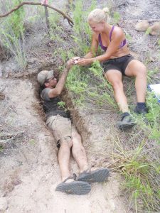 Field assistants Mikey Kartje and Tanja Laaser extract an egg during a nest excavation.
