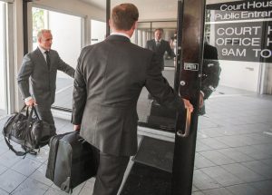 Accountant Rob Aspinall, left, and his attorney James Austin-Smith report to the Cayman Islands Grand Court on Friday. – Photo: Matt Lamers