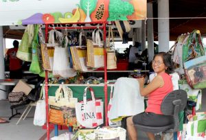 Lyn Levy works on a batch of Siggy bags.