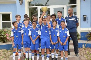 Academy’s U-13 team with coach Paul Byles after their FA Cup win.