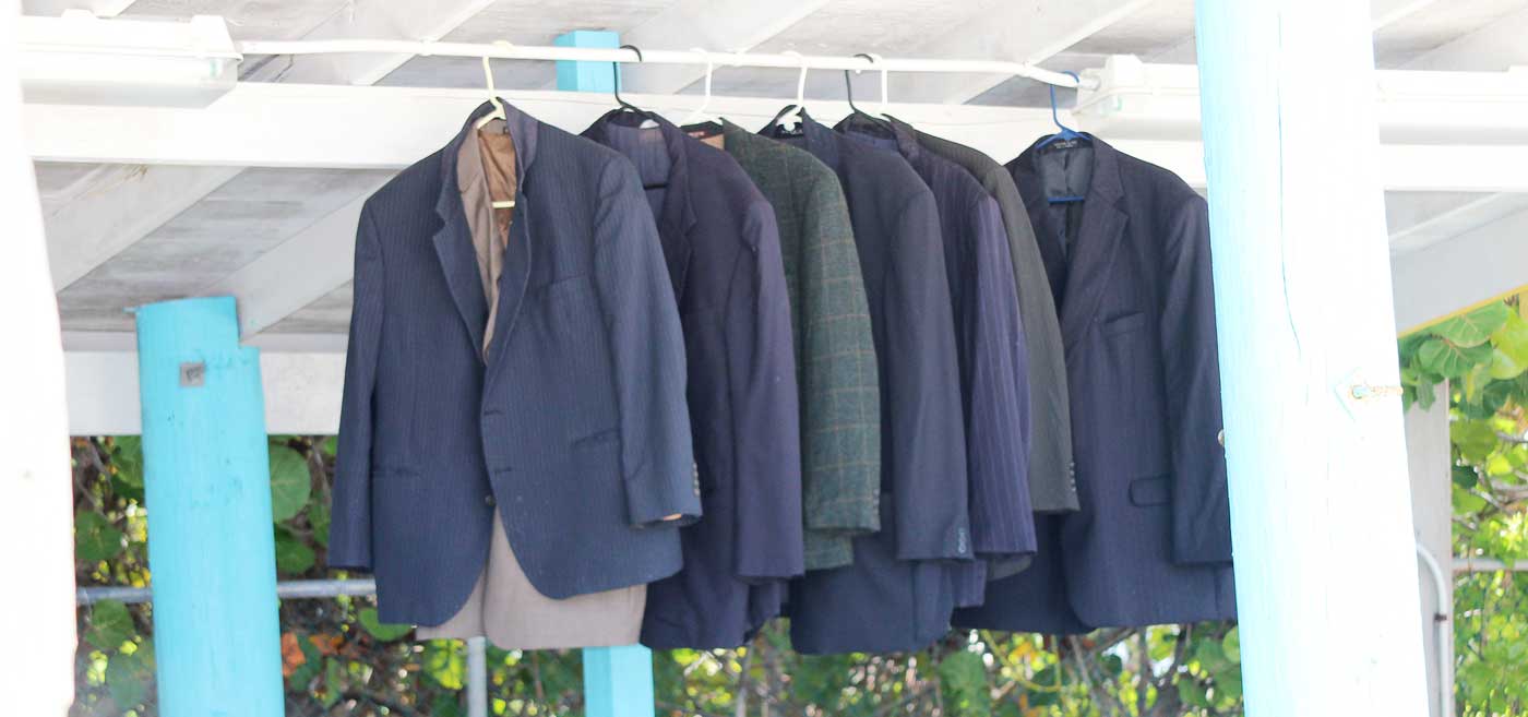A row of Mr. McLaughlin’s suit jackets hang neatly inside the cabana.