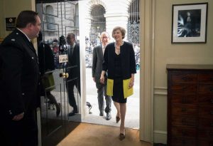 New Prime Minister Theresa May, followed by her husband Philip May, walk into 10 Downing Street, London, on Wednesday. - PHOTO: STEFAN ROUSSEAU VIA AP