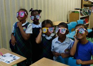 The after-school kids sport goofy sunglasses.