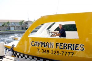 Ronnie Anglin behind the wheel of the new Cayman ferry. - PHOTO: JAMES WHITTAKER