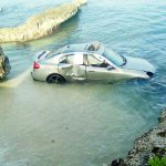 Car goes over wall into sea
