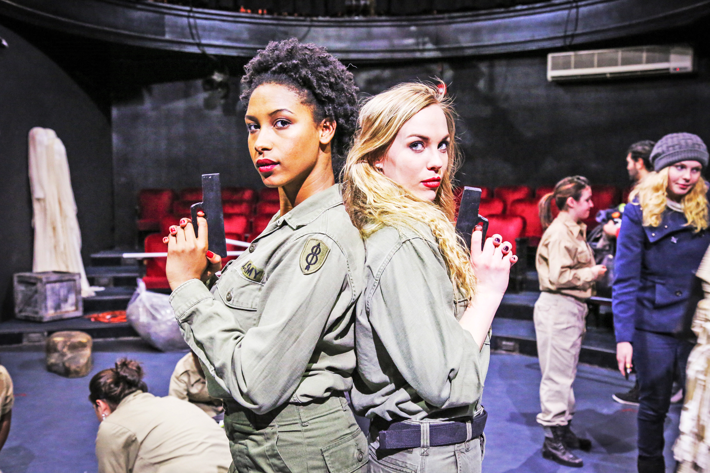 Caitlin Tyson, left, played the part of Cassius in her academy's all-female graduation play, 'Julius Caesar.'