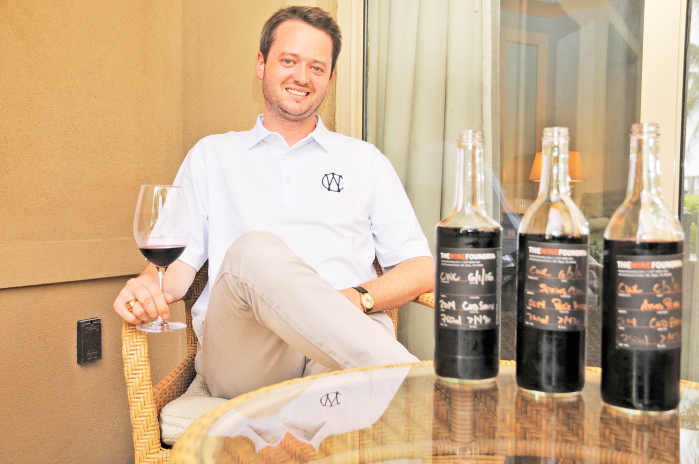 Michael Kennedy, former head sommelier with The Ritz-Carlton, Grand Cayman, with barrel-tasting bottles of his Component Wine Company wines. - Photos: Alan Markoff