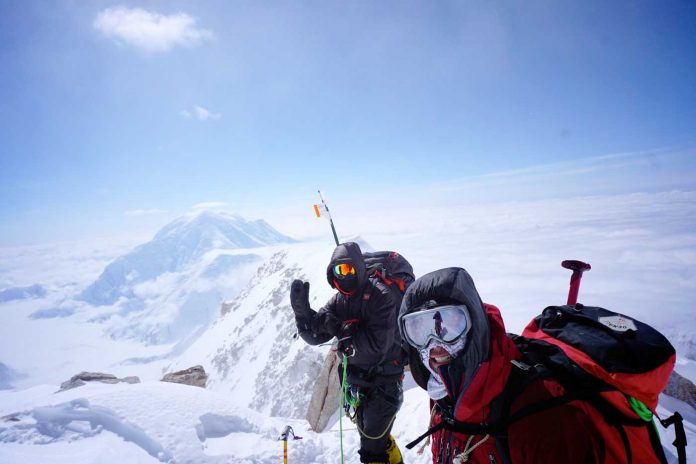 Guy-Manning-and-John-Moorhouse-at-16,000-feet-on-the-ridge-between-Camp-3-and-High-Camp,-with-Mount-Foraker-in-the-background