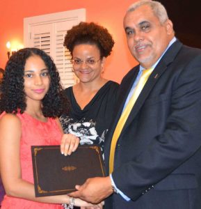Giselle Ebanks with Education Minister Tara Rivers and Youth Minister Osbourne Bodden.