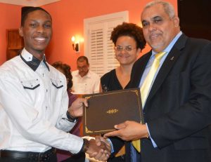 Bruce Gordon with Education Minister Tara Rivers and Youth Minister Osbourne Bodden.