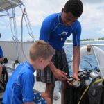 Disabled divers get help from students