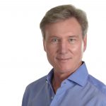 Real estate broker Lund back on island after fall