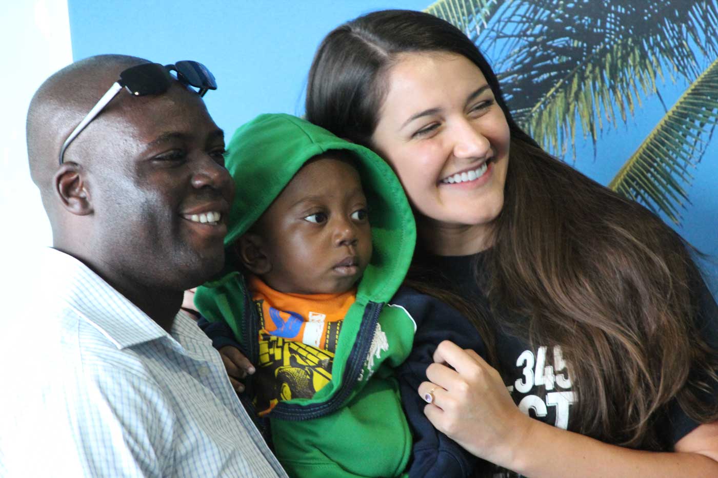 Barnabas Rinvil and his nephew Makendy pose with Holly Thompson of Impact 345 in Grand Cayman just before takeoff Saturday.