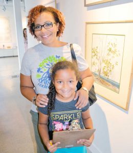 The National Trust's Karie Bounds with one of the  young campers.