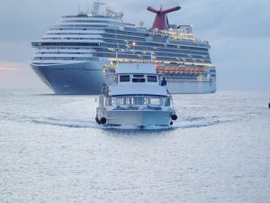 The Carib Empress heads to the dock after picking up a patient and crew from the Carnival Dream. - Photo: Carol Winker