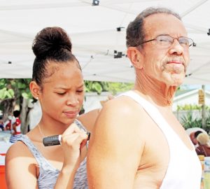Frank Flowers Sr. gets his age group marking from Jada Watson.