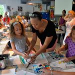 Young artists explore watercolors at Family Day