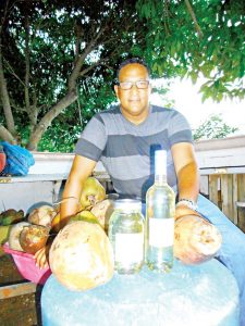 Joel Jackson with his home-produced coconut oil.