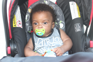Ian Jervis admires the activities of his siblings from the comfort of his stroller.