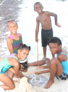 East End children Ava Rico, Amiah, Jamar and Janae Jervis enjoy the beach during mid-term break from school. - PHOTOS: JEWEL LEVY